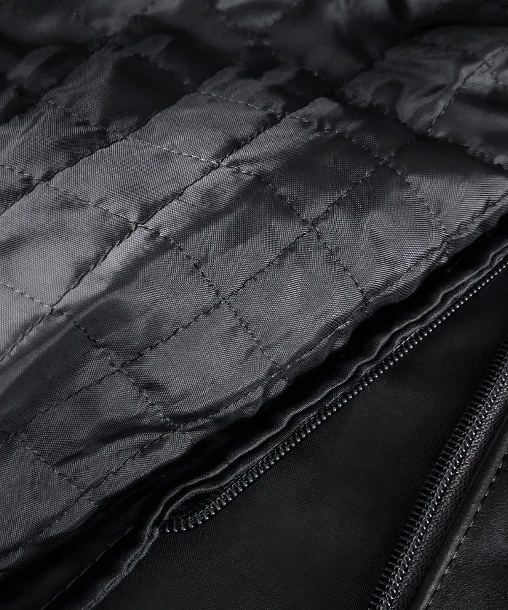 close-up shot of the inside of a black quilted jacket