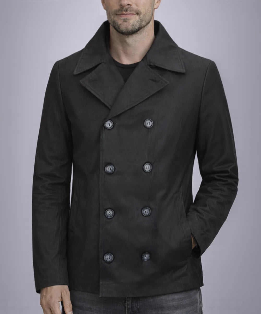 Model wearing men's black pea coat with slim fit styling and classic navy inspired design