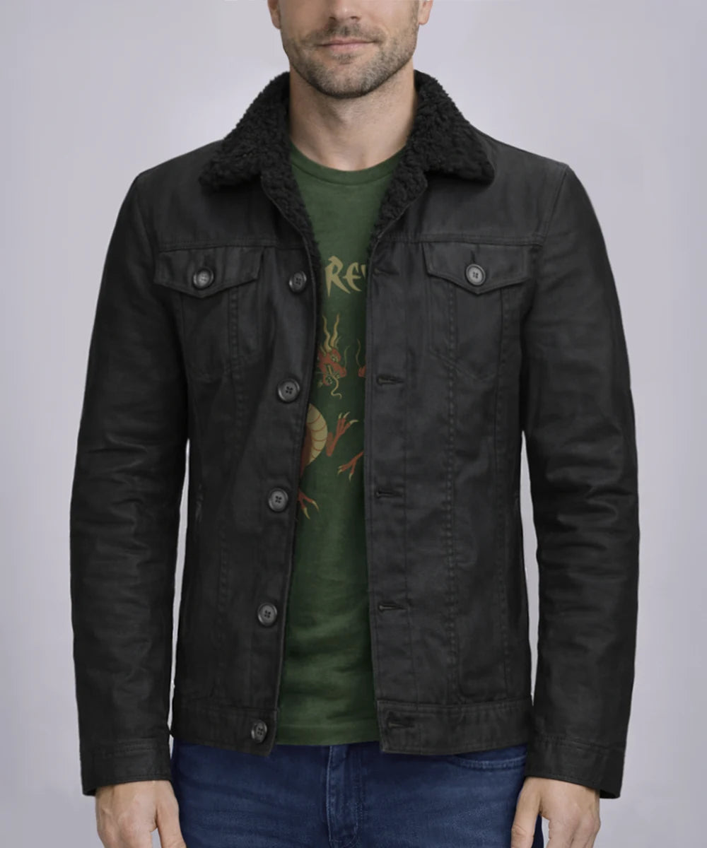 model wearing a vintage style trucker jacket in black cotton with a black wool collar
